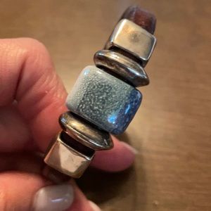 Brown leather, silver and ceramic beads. Strong magnetic clasp. 7.5 inches.